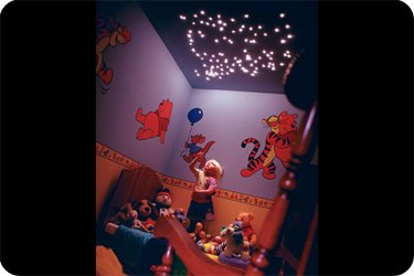 small childrens bedroom with cluster of lights in ceiling