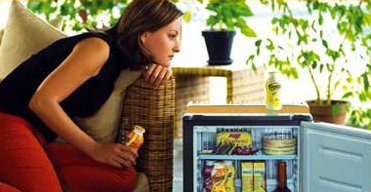 Woman with a Dometic minicool silencio fridge