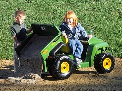 John Deere kids ride on gator with tipper on the back
